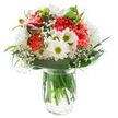 Uplifting and vibrant, this bouquet-crafted with the care and tradition of Shadwell Florist-stands luminous in a gleaming glass vase, its vivid colors accentuated by a stark white background. Plush, cheerful coral-pink carnations anchor the design, their ruffled petals bursting forth with exuberance and a subtle, sweet fragrance that immediately enlivens the senses. Nestled around them are crisp white chrysanthemums and daisies, their myriad fine petals and sunny green-yellow centers echoing the fresh, uncomplicated beauty found in Shadwell's local parks in early spring. Wispy baby's breath weaves through and between the blooms, casting a dreamy haze reminiscent of gentle river mist near Shadwell Basin. A few tightly closed alstroemeria buds, tinged with magenta and purple, hint at days to come, their quiet promise adding mystery and anticipation. The bouquet is lovingly framed by a collar of deep green, glossy foliage, artfully arranged with both broad and slender leaves to cradle the blossoms in a natural, welcoming embrace. Visible through the vase's crystal-clear water, fresh green stems underscore the arrangement's vitality-a testament to Shadwell's daily flower market freshness. Bathed in soft, even daylight, the composition exudes harmony and optimism, making it a perfect centrepiece for celebrations, thank yous, or simply infusing warmth and comfort into a home along the Thames. This bouquet brings local artistry and a sense of joyful renewal to anyone who receives it.